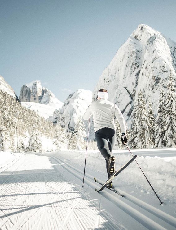 A male cross-country skier seen from behind